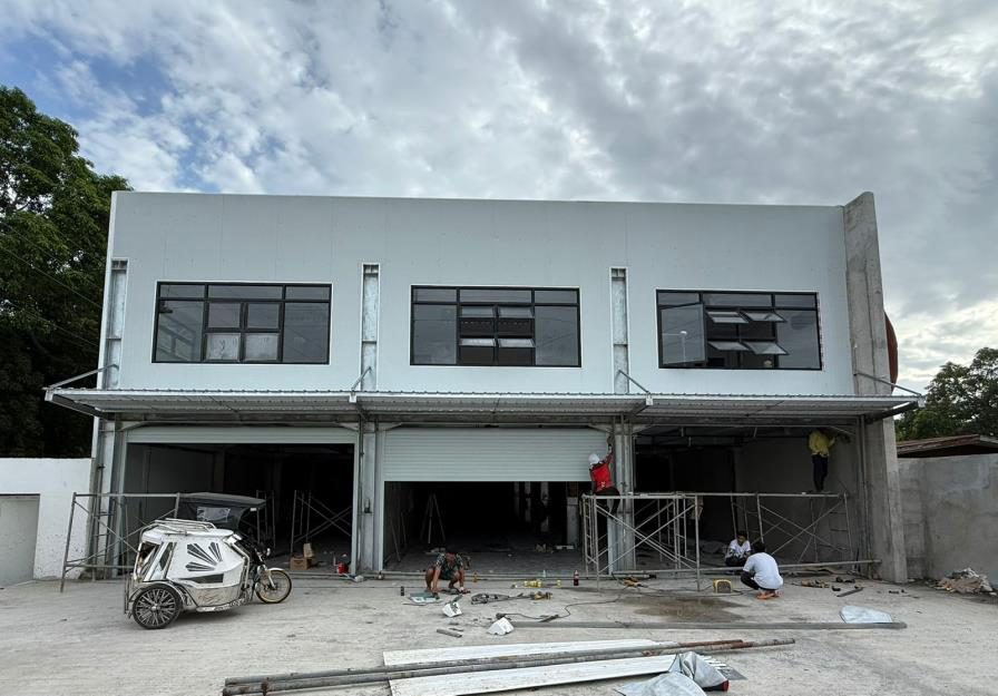Commercial building with shopfronts and warehouse